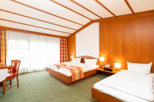 Postel nebo postele na pokoji v ubytování Hotel Brauerei Gasthof Höhn