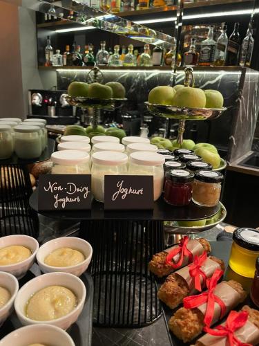 a display of food on a table in a kitchen at Hotel Collect - Adults Only in Budapest