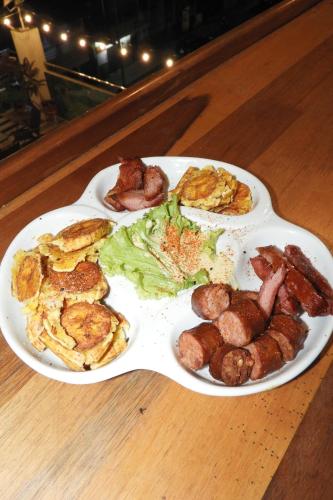 two white plates of food on a table at Casa Nativa Iquitos in Iquitos