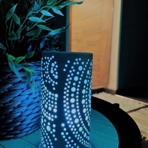 a blue vase sitting next to a potted plant at Hotel Nordend in Gressoney-la-Trinité