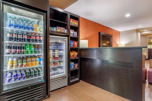 a refrigerator filled with lots of drinks at Comfort Suites in Georgetown