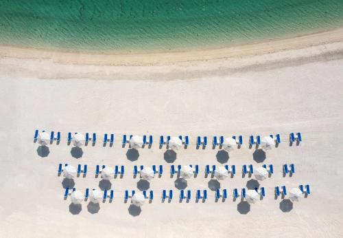 an overhead view of a group of people on the beach at Radisson Resort Ras Al Khaimah Marjan Island in Ras al Khaimah