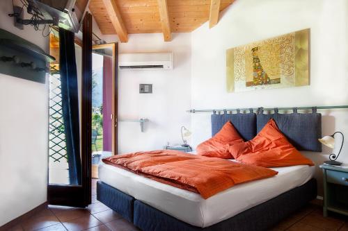 Säng eller sängar i ett rum på Agritur La Cort