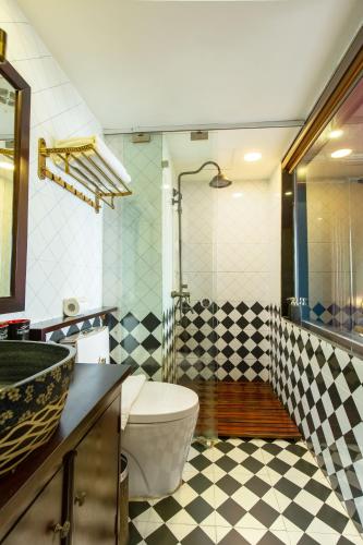 a bathroom with a sink and a toilet and a shower at Sapa House Hotel Halal Certified in Sapa