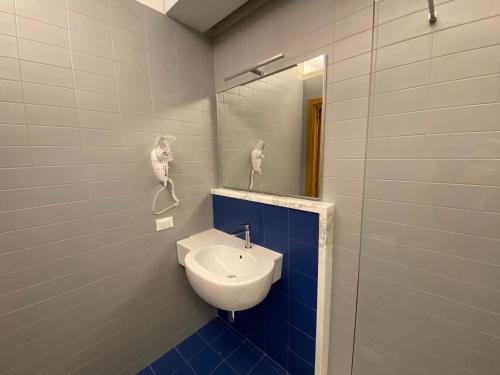 a bathroom with a sink and a mirror at Casa Nostra in Selva del Montello