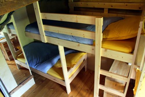 a couple of bunk beds in a room at La Paille in Pelvoux