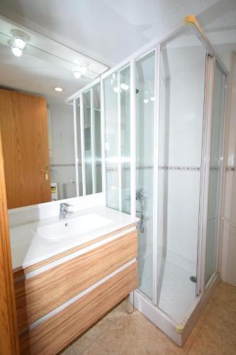a bathroom with a sink and a shower at Miramar Playa II- Fincas Arena in Benidorm