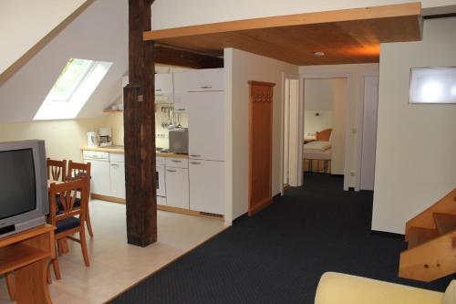 Kuchyň nebo kuchyňský kout v ubytování Appartements im Forsthaus