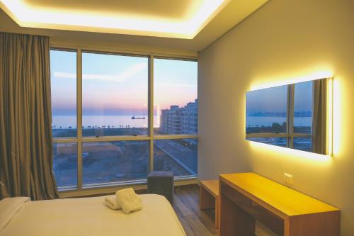 Ένα ή περισσότερα κρεβάτια σε δωμάτιο στο The Stay Furnished Apartments