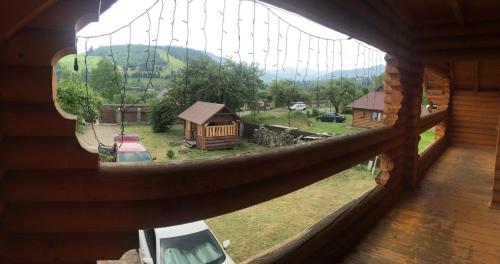 a view from a window of a log cabin at Приватний котедж «Наш Черемош», с.Ільці in Iltsi