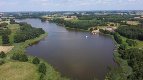 an aerial view of a large river with trees at Domek Letniskowy, Dom Całoroczny Eryś 80m2. Przy Plaży. Wynajem. Odpoczynek in Książki