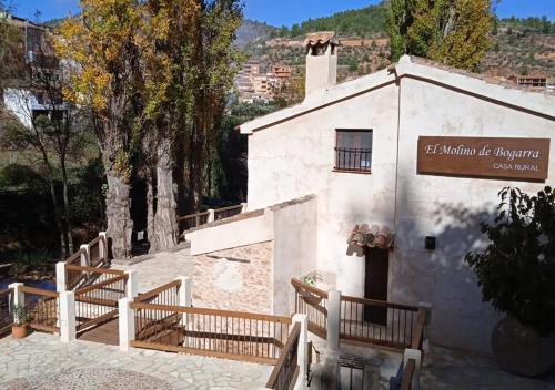 a building with a sign on the side of it at Casa rural El Molino de Bogarra in Bogarra
