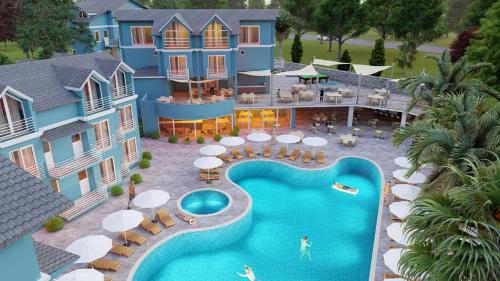 an aerial view of a resort with a swimming pool at Blue Pearl Hotel in Ovacik