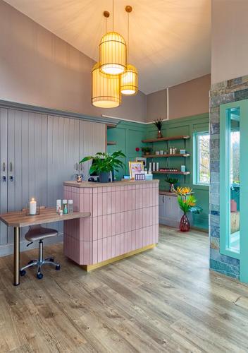 an office with a pink counter and a desk at Loch Rannoch Hotel and Spa in Kinloch Rannoch