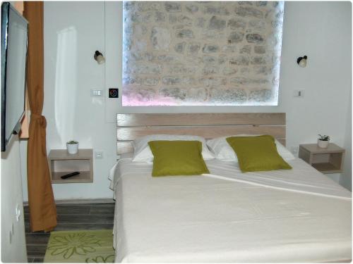 Postel nebo postele na pokoji v ubytování Apartments Mila