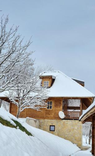 a house with snow on the roof at Rankovi konaci in Zlatibor