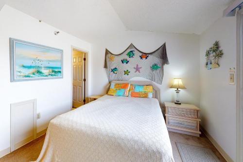 מיטה או מיטות בחדר ב-Surfcrest 201