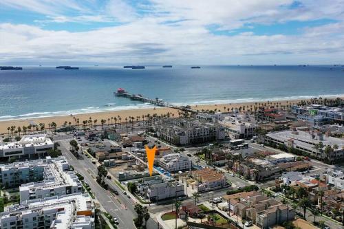 an aerial view of a city and the beach at Steps To The Beach, Main Street and Pacific City - OCEAN VIEWS in Huntington Beach