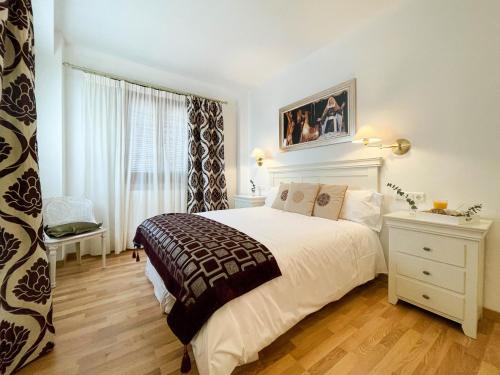 a bedroom with a large bed and a window at CASA GALA BIAR. TRANQUILIDAD, ENCANTO Y AIRE PURO. in Biar