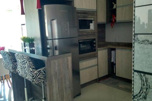 Dapur atau dapur kecil di Apartamento aconchegante em Bento Gonçalves, próximo ao vale dos vinhedos