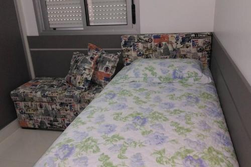 Katil atau katil-katil dalam bilik di Apartamento aconchegante em Bento Gonçalves, próximo ao vale dos vinhedos