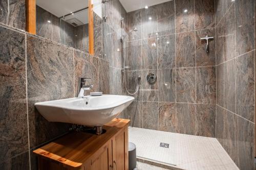 a bathroom with a white sink and a shower at Burg Gutenfels in Kaub