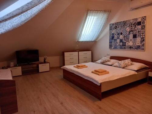 Postel nebo postele na pokoji v ubytování Alegria Natur Apartments