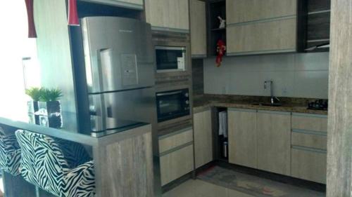 Dapur atau dapur kecil di Apartamento aconchegante em Bento Gonçalves, próximo ao vale dos vinhedos