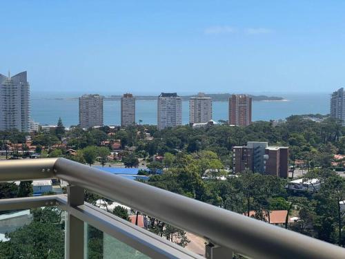 a view of a city from the balcony of a building at Edif. Place Lafayett Piso 19, 3 dormitorios y excelentes amenities in Punta del Este