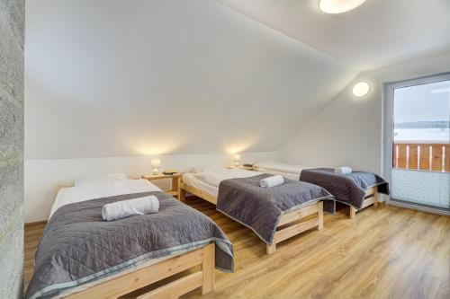Postel nebo postele na pokoji v ubytování Chyże na Zbyrze