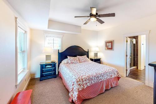 a bedroom with a bed and a ceiling fan at Allure #15-S in Salvo