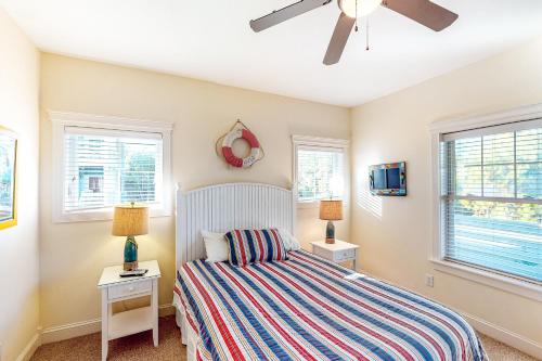 a bedroom with a bed and a ceiling fan at Allure #15-S in Salvo