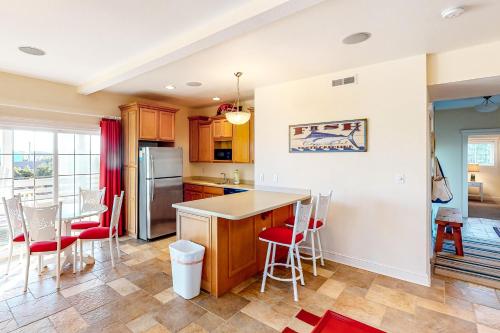 a kitchen with a counter and a table and chairs at Allure #15-S in Salvo