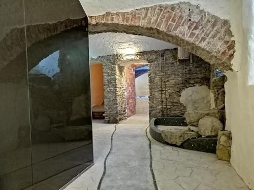 a room with a stone wall and an archway at Kernu Manor Hotel & SPA in Kernu