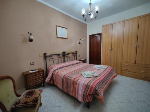 Ένα ή περισσότερα κρεβάτια σε δωμάτιο στο B&B IL FEUDO