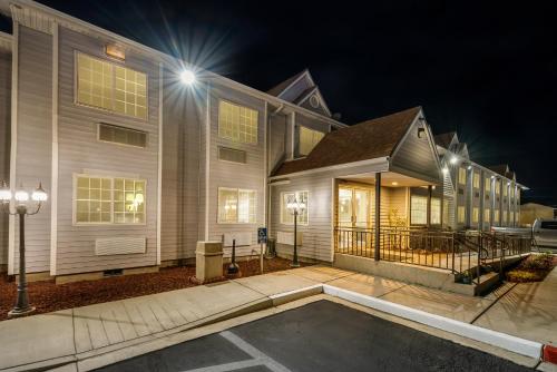 a home at night with a driveway in front of it at Quality Inn & Suites near NAS Fallon in Fallon