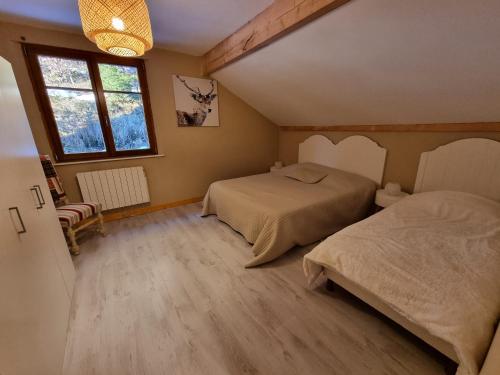 Lova arba lovos apgyvendinimo įstaigoje Gîte Liam
