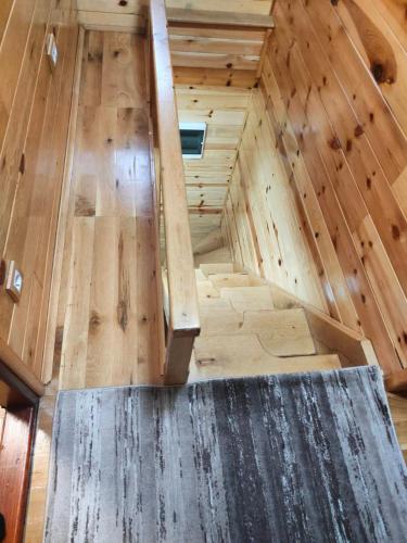 an overhead view of a wooden attic room with a staircase at Vila Sofija Tornik in Ribnica