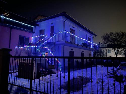 a house with christmas lights on the front of it at Dely B&B in Arquata Scrivia