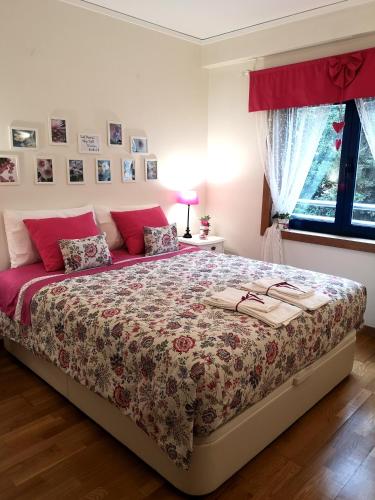 a bedroom with a bed with a floral bedspread at Architect House in Porto
