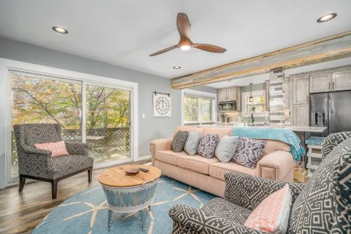 a living room with a couch and a table at Bee Branch 05 in Sugar Mountain