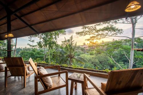 a view from a room with chairs and a table at The Hidden Paradise Ubud - CHSE Certified in Ubud