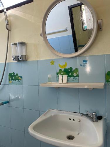 a bathroom with a sink and a mirror at Pai Modern House in Pai