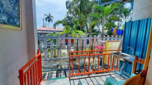 a balcony with a view of a amusement park at Runa Runa The Best Samed Island in Ko Samed