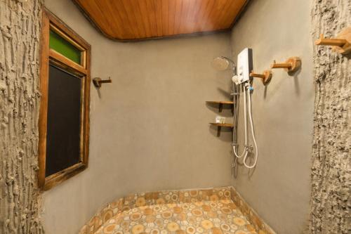 a bathroom with a shower and a tub at Mafiya Resort in Koh Rong Island
