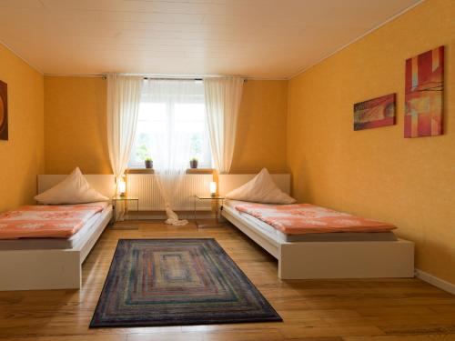 Posteľ alebo postele v izbe v ubytovaní Ades Haus - wenn's gemütlich sein darf!