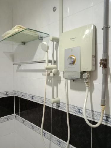 a room with a hair dryer in a bathroom at Glory Beach Resort PriVate PentHouse in Port Dickson
