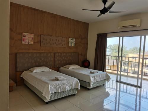 Postel nebo postele na pokoji v ubytování Gold Coast Morib Resort