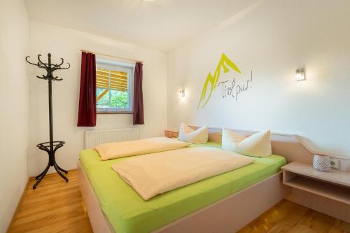 Ένα ή περισσότερα κρεβάτια σε δωμάτιο στο Aparthotel Hummerau