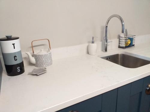 a kitchen counter top with a sink and a counter top at Are you looking for a big piece of heaven? in Warrenpoint